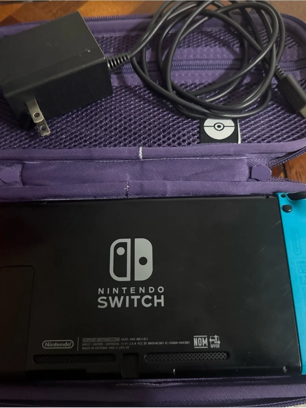 Nintendo Switch with Blue Left & Red Right Joy-Con and Purple Carry Case